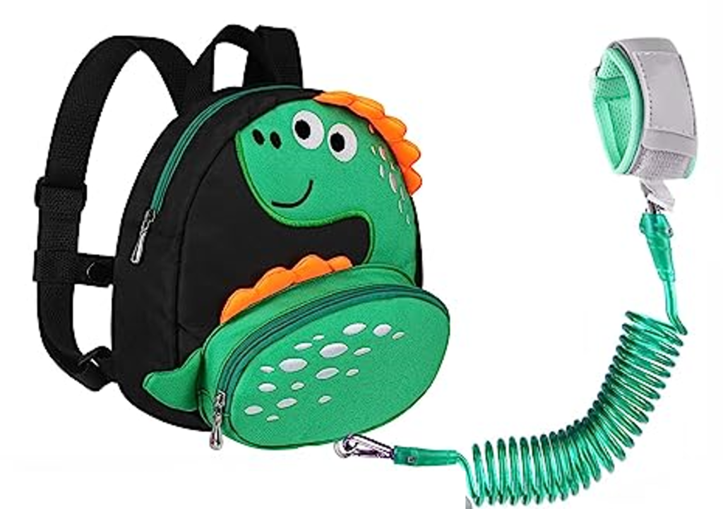 A toddler backpack with a dinosaur on it and leash for a variety of outdoor toddler activities.