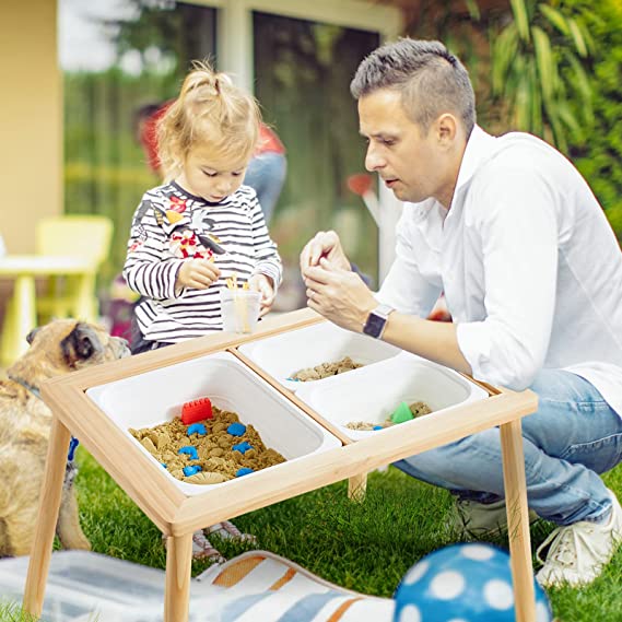 Father and daughter playing at a sensory table.